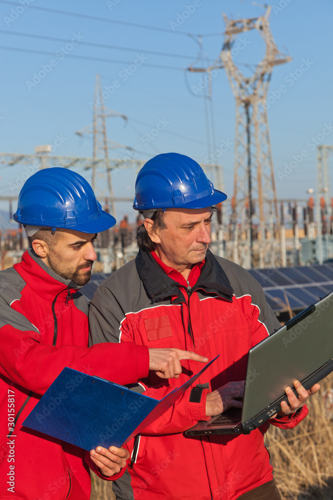 Engineers at Work In a Solar Power Station Engineers at Work In a Solar Power Station
