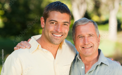 Father with his son looking at the camera in the park