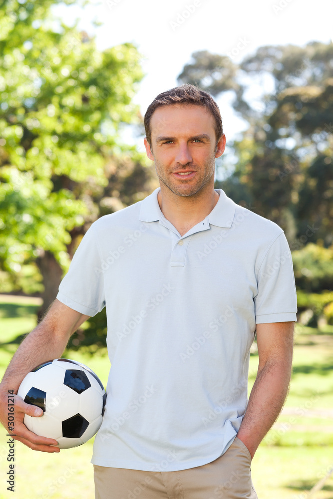 Naklejka premium Handsome man with a ball