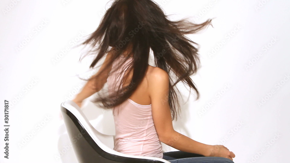 Happy woman spinning on chair