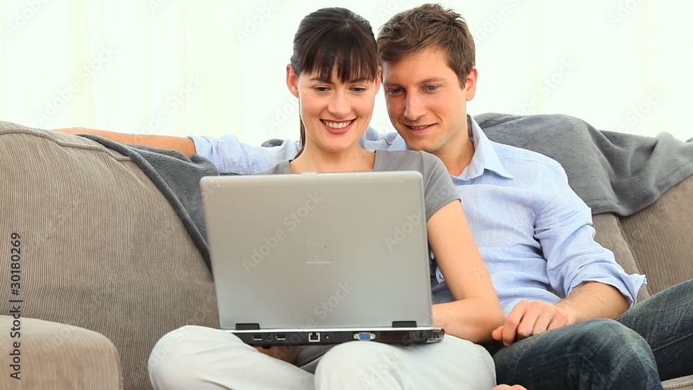 Young couple using a laptop Young couple using a laptop