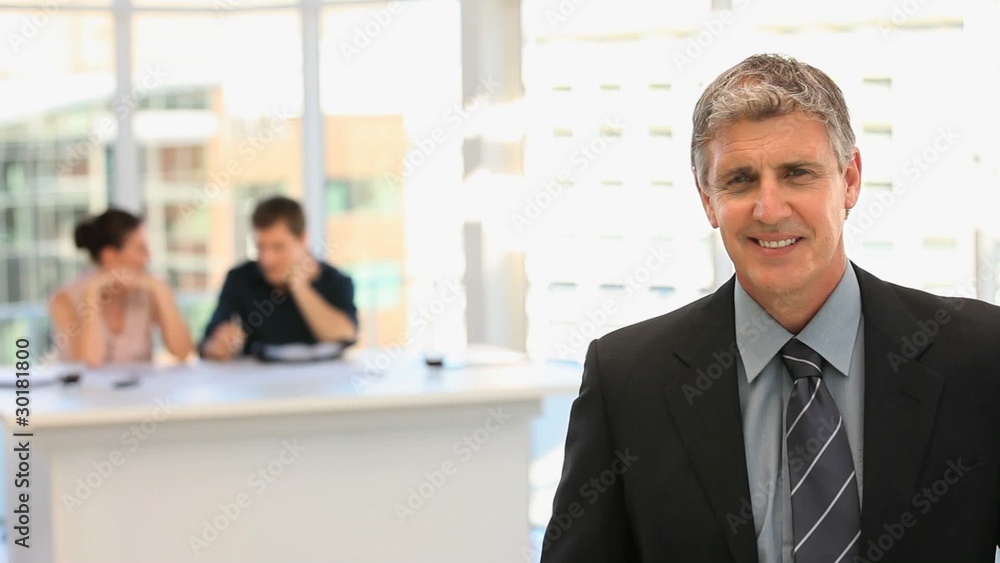 Middle aged businessman looking at the camera Middle aged businessman looking at the camera