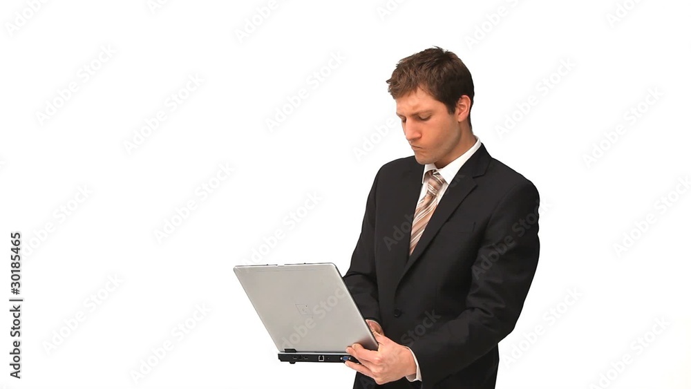Young man in suit holding a laptop Young man in suit holding a laptop