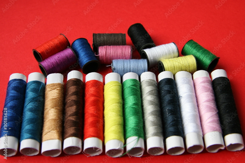 Threads on a red background Threads on a red background