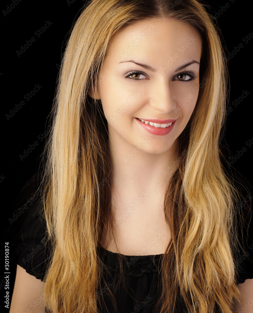 Naklejka premium Beautiful woman with long blond hair smiling