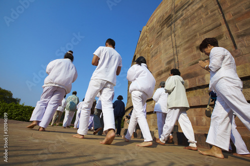 Pilgrims praying at the Buddhist Stupa in Sarnath