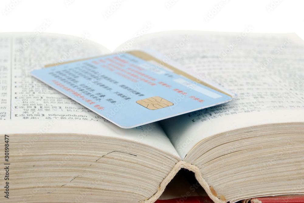 Obraz premium Dictionary and credit card