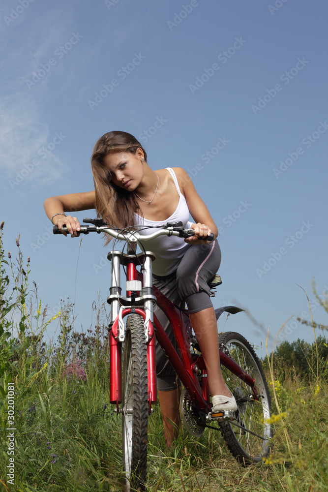 beauty girl on bike in summer day beauty girl on bike in summer day