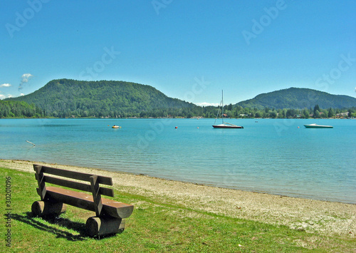 Slovenian bench beside a lake in summer