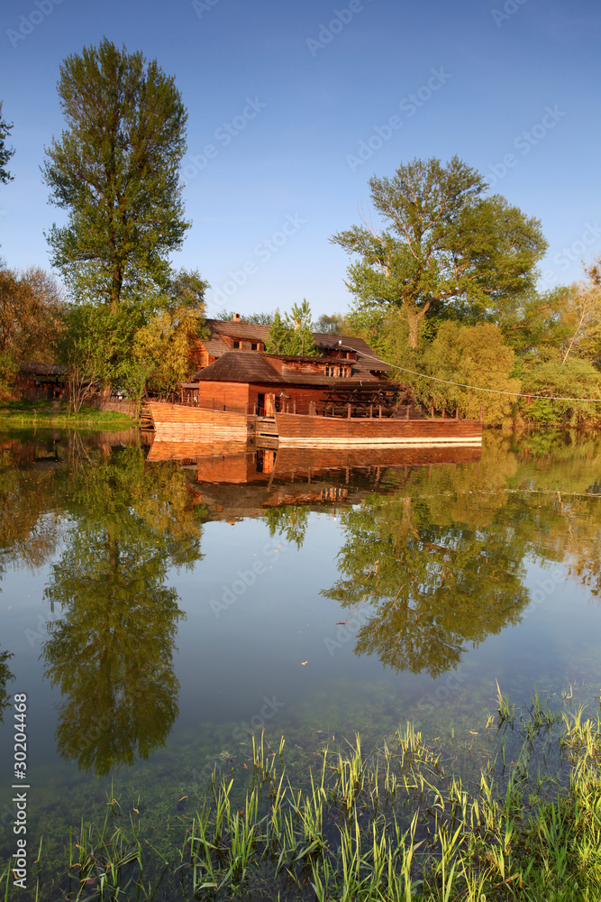 Fototapeta premium Spring landscape with water mill