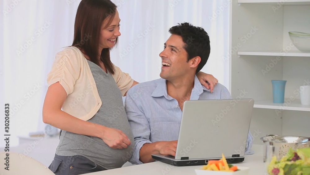 Future parents using a laptop Future parents using a laptop