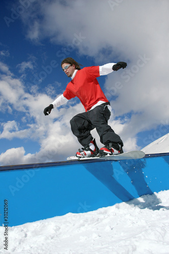 Snowboarder in snow park