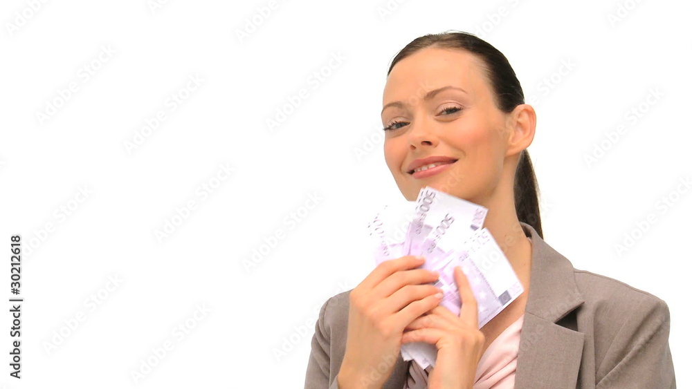 Businesswoman counting her money against a white background Businesswoman counting her money against a white background