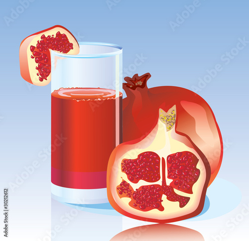 Fresh pomegranate and fresh garnet juice in a glass