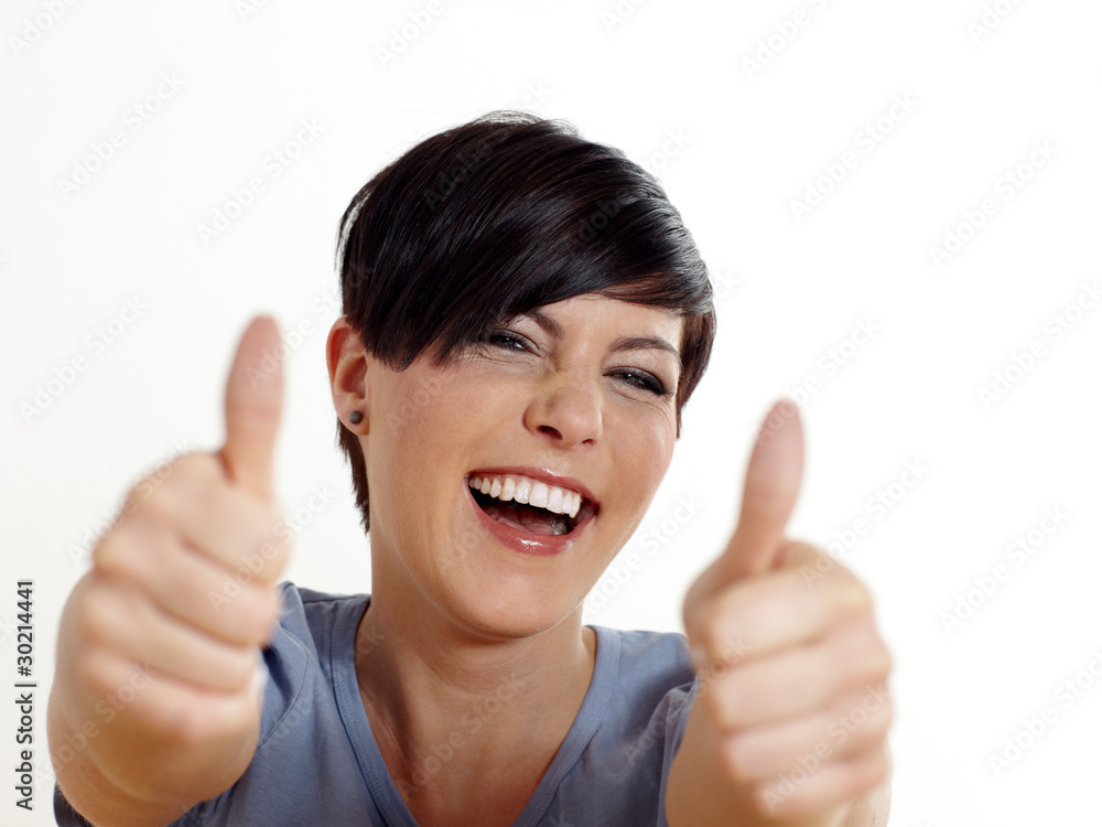 Portrait of attractive young female showing thumbs up Portrait of attractive young female showing thumbs up
