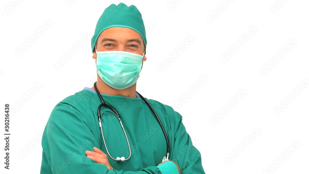 Doctor in green uniform looking at the camera Doctor in green uniform looking at the camera