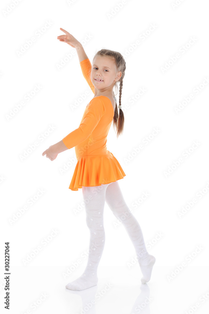 beautiful ballerina dancing in an orange dress. beautiful ballerina dancing in an orange dress.