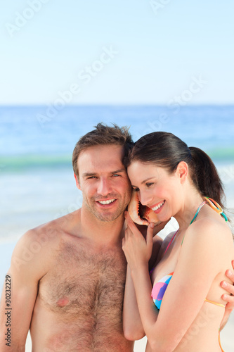 Couple listening to their shell