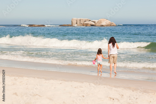 Mother and her daughter on the beach