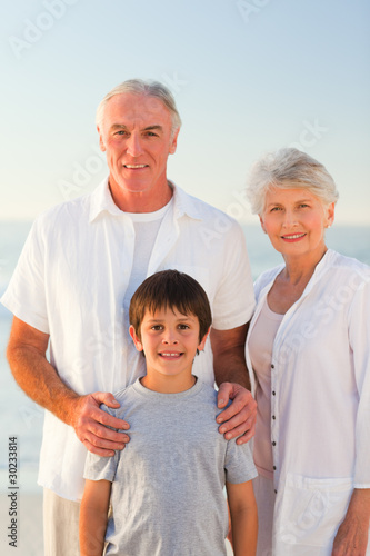 Grandparents with his grandson at the beach