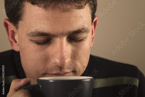 Portrait of man drinking hot beverage