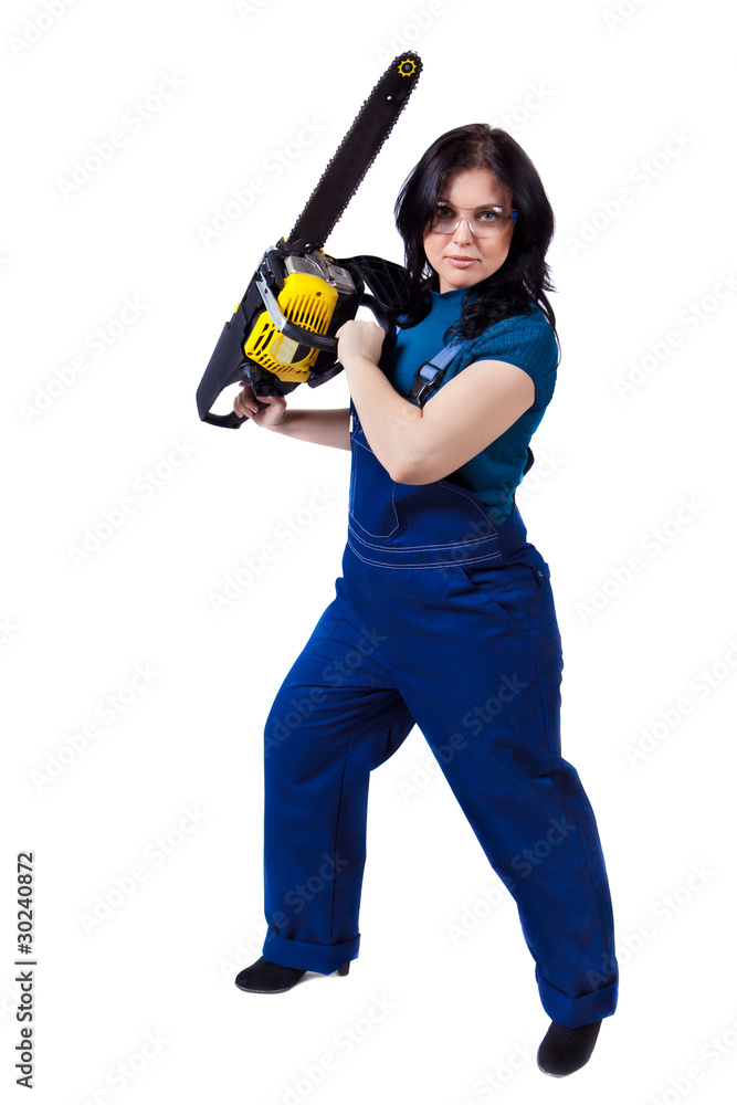 Pretty woman in coveralls with the chainsaw Pretty woman in coveralls with the chainsaw