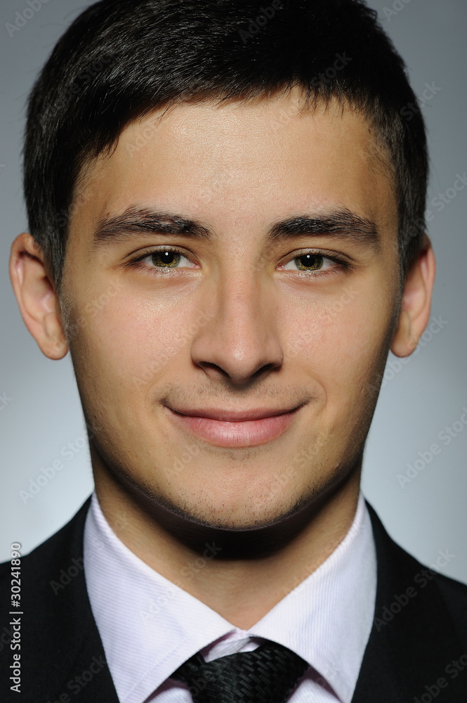 Portrait of smiling business man in formal suit and black tie . Portrait of smiling business man in formal suit and black tie .