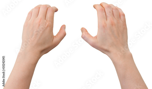 Hands of a caucasian female clinging on some wall edge, isolated
