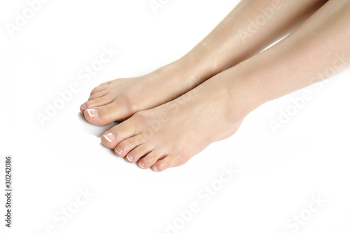 Fototapeta Naklejka Na Ścianę i Meble -  Beautiful feet leg with perfect french spa pedicure. white backg