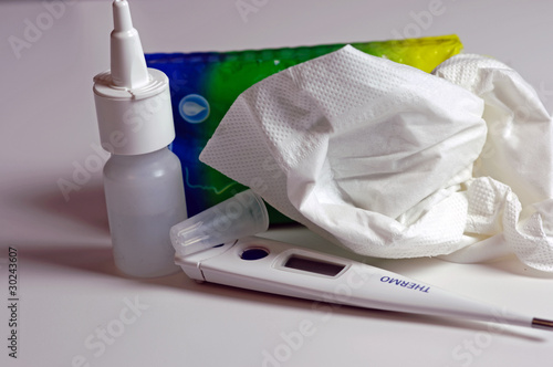 Napkins, nose drops and thermometer photo