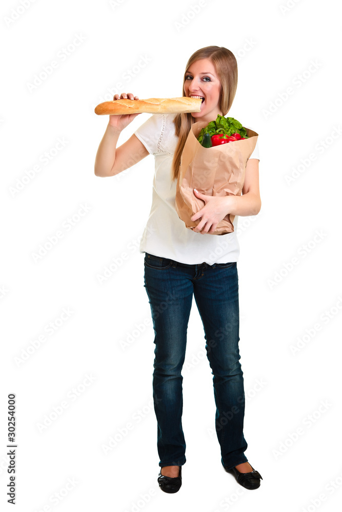 Woman carrying bag of groceries isolated on white Woman carrying bag of groceries isolated on white