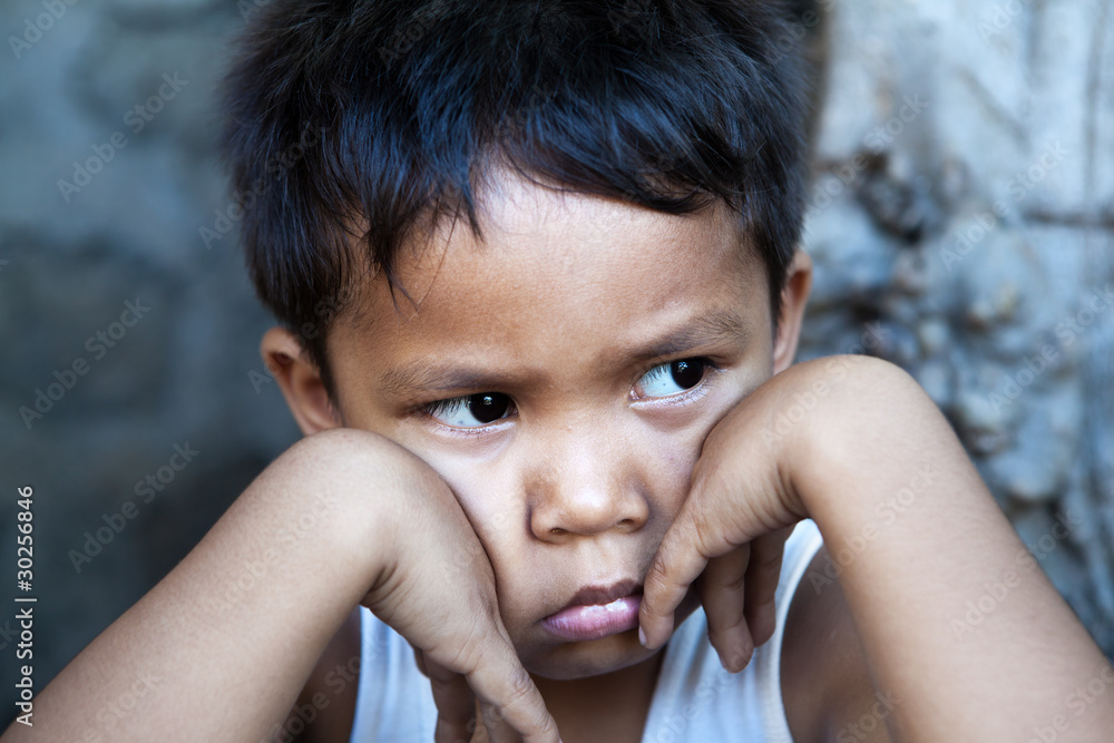 Young Filipino boy portrait - poverty in the Philippines