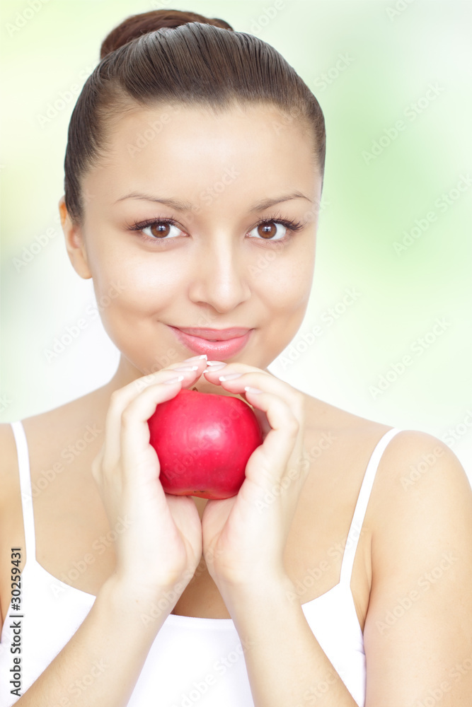 girl holding a red apple on green background girl holding a red apple on green background
