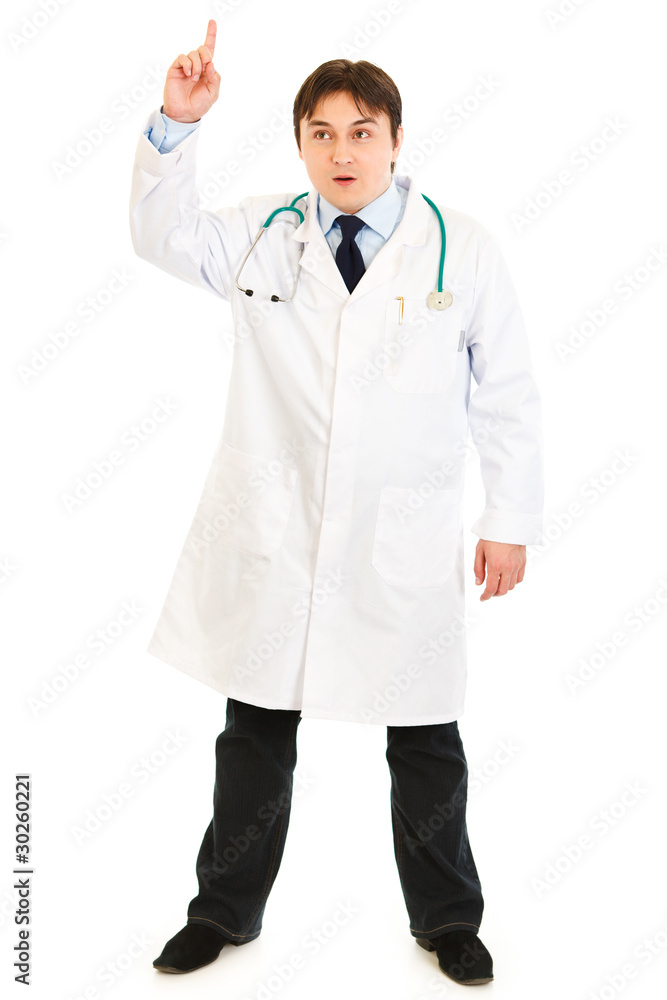 Surprised medical doctor with rised finger. Idea gesture. Surprised medical doctor with rised finger. Idea gesture.