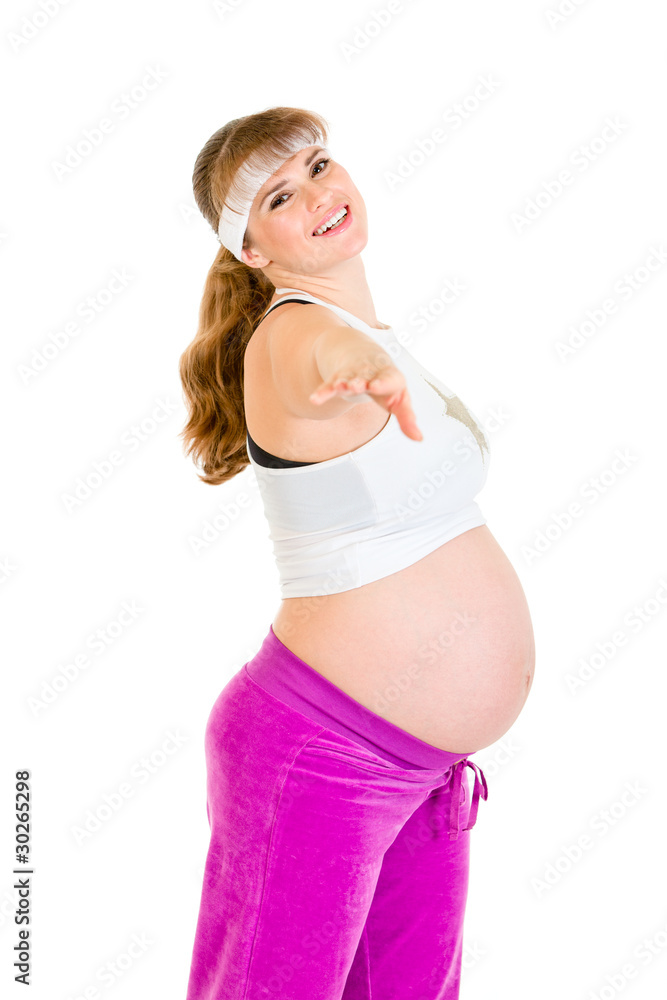 Smiling beautiful pregnant female doing exercise isolated Smiling beautiful pregnant female doing exercise isolated