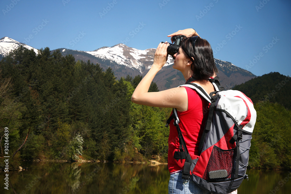young photographer shooting nature