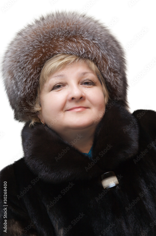 Beautiful woman wearing in fur hat and in fur coat Beautiful woman wearing in fur hat and in fur coat
