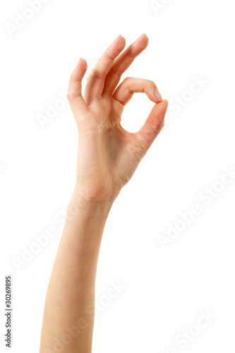 Ok gesture of female hand isolated on white photo