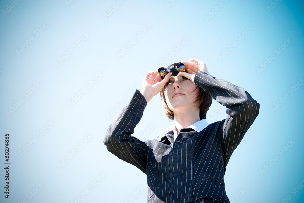 Young caucasian business lady with binoculars Young caucasian business lady with binoculars