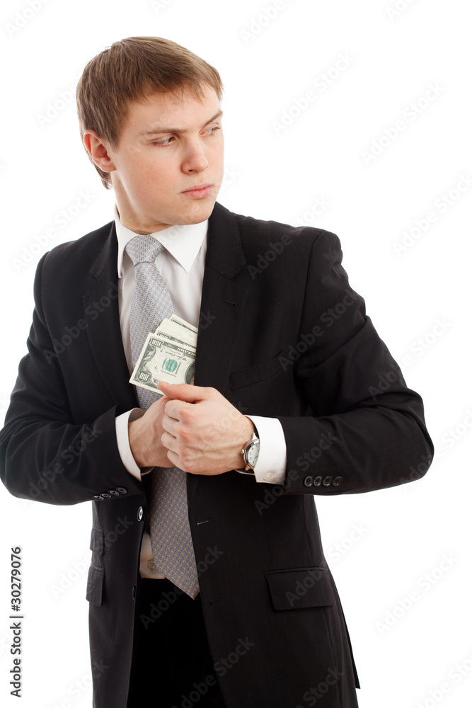 Man in a putting money in his pocket. Man in a putting money in his pocket.