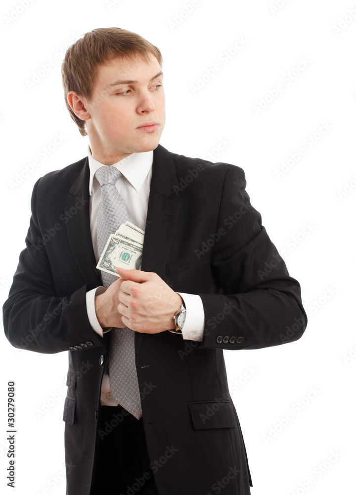Man in a putting money in his pocket. Man in a putting money in his pocket.