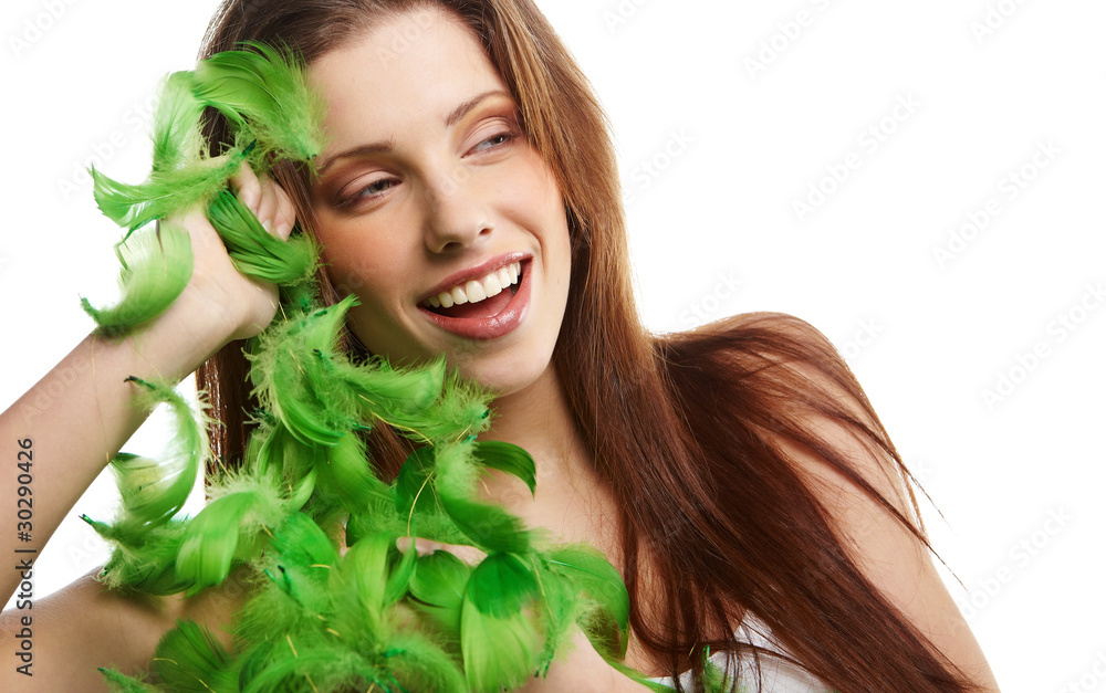 Portrait of a stunning brunette with green feathers Portrait of a stunning brunette with green feathers