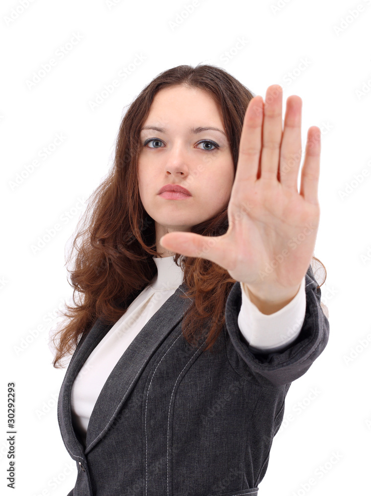 Serious businesswoman making stop sign on white Serious businesswoman making stop sign on white