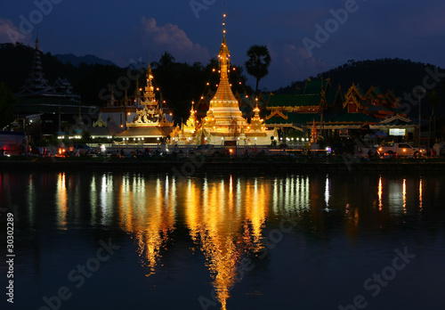 The pagoda reflect the water in the night, Maehongsorn, North of