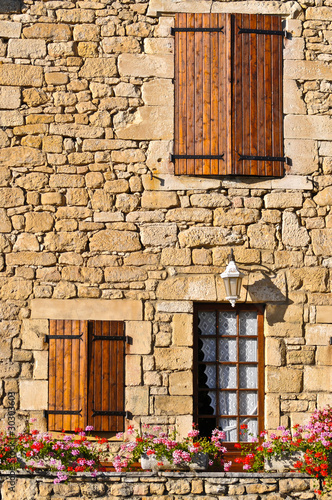 Fototapeta Naklejka Na Ścianę i Meble -  Three windows on Stone wall