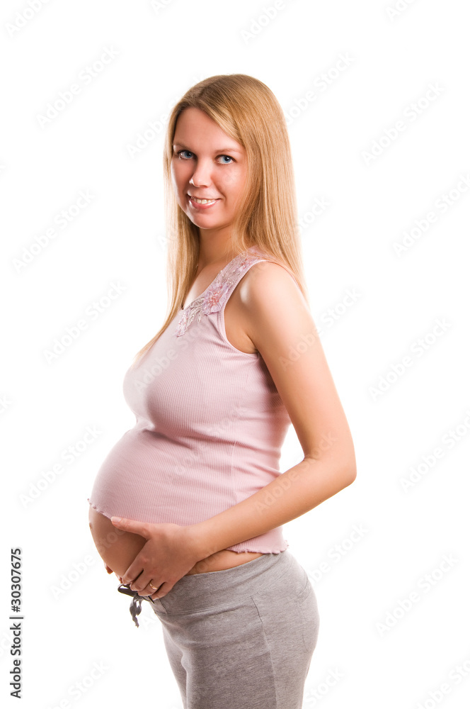 Beautiful young pregnant blonde girl on white background Beautiful young pregnant blonde girl on white background