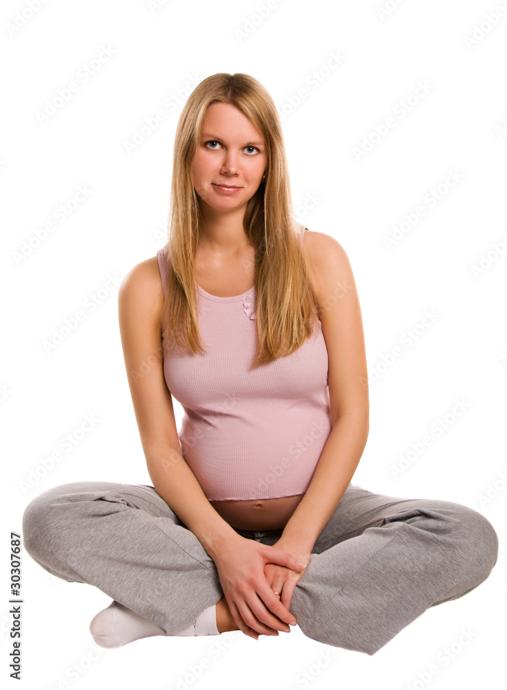 Beautiful young pregnant blonde girl on white background Beautiful young pregnant blonde girl on white background