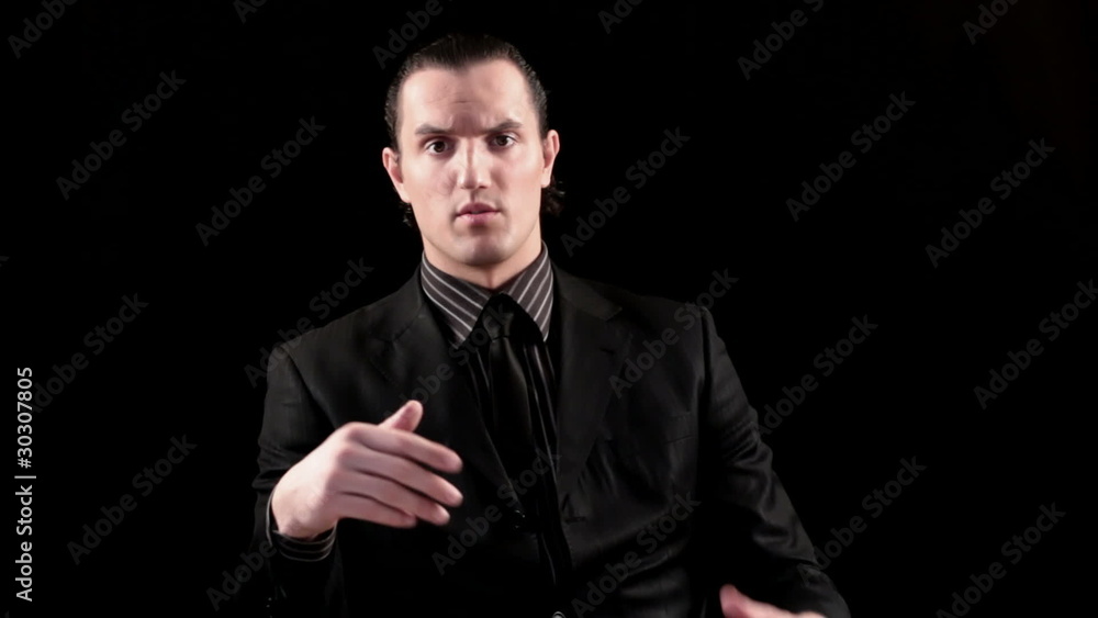 businessman speaking on black background businessman speaking on black background