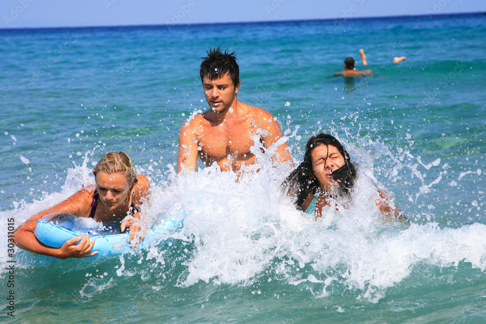 on the beach having lots of fun in their vacation on the beach having lots of fun in their vacation