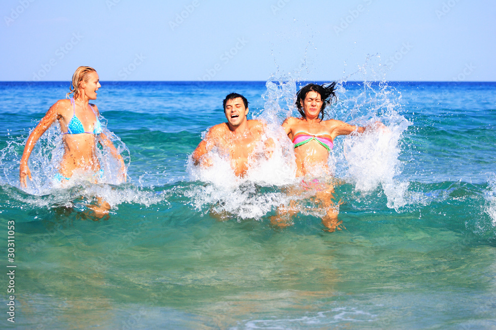 on the beach having lots of fun in their vacation on the beach having lots of fun in their vacation